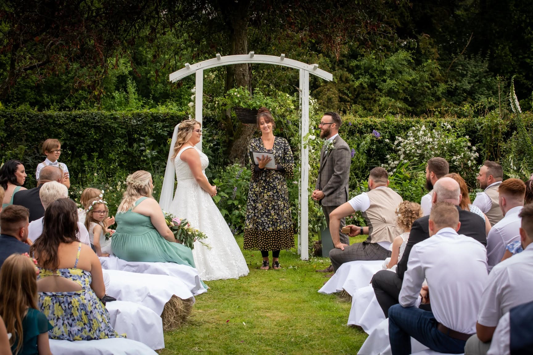 Rebecca conducting an outdoor garden wedding ceremony