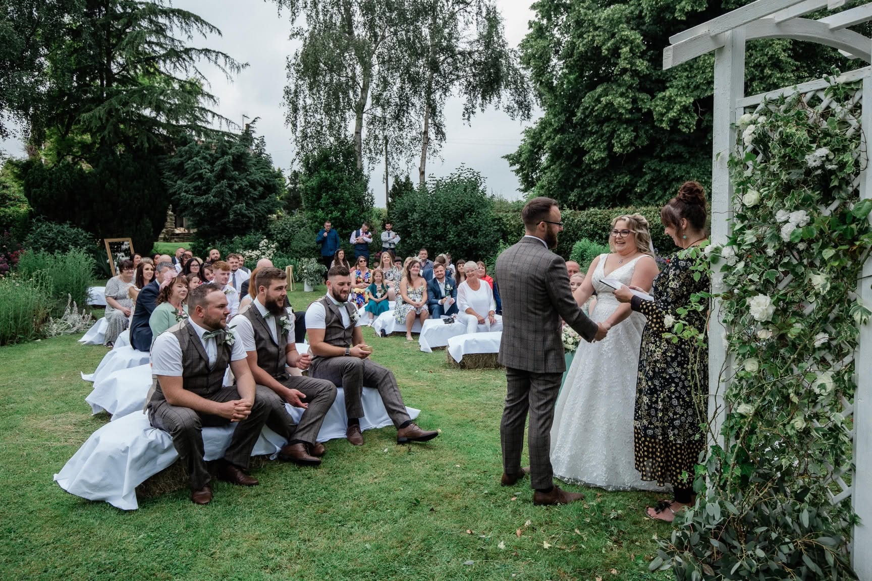 Outdoor wedding ceremony with guests