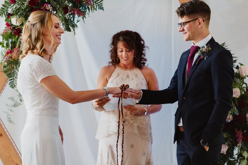 Bride and groom exchanging a keepsake during their ceremony